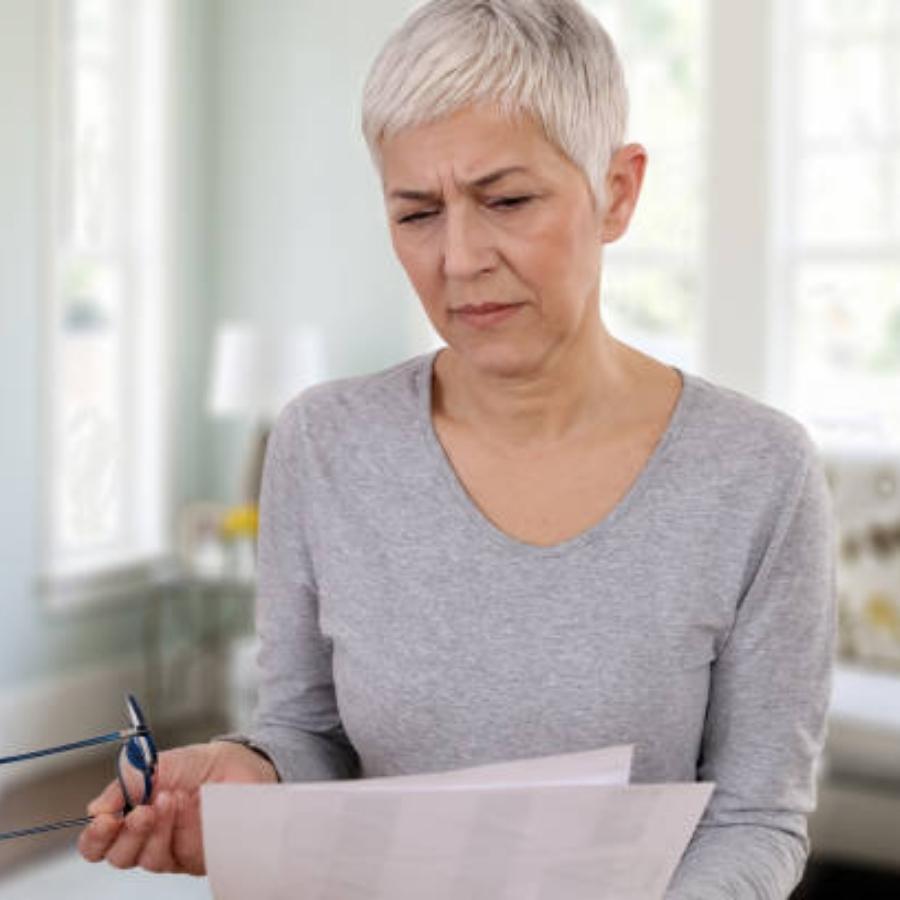 senior woman stressing on a timeshare contract
