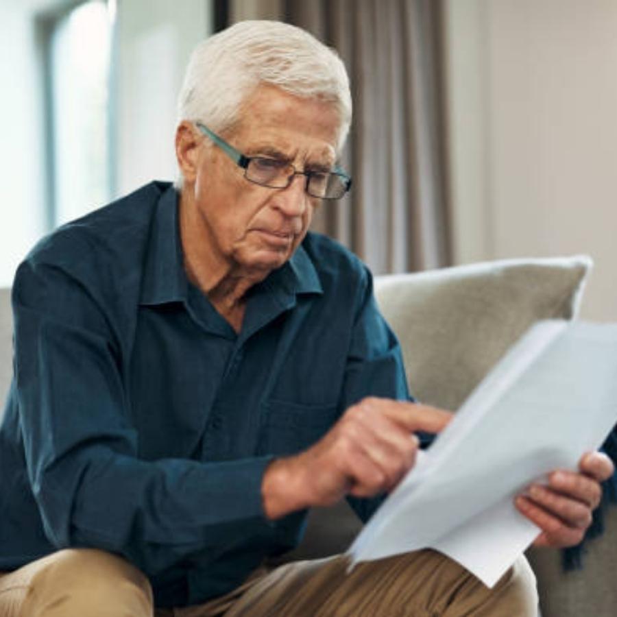 senior man reviewing a timeshare contract