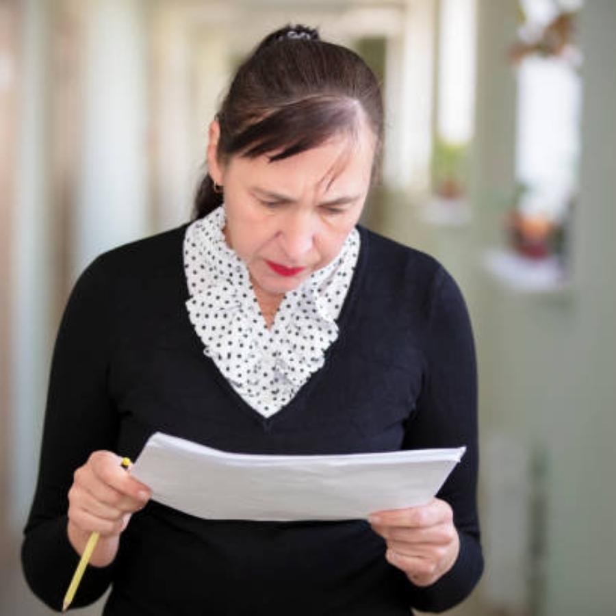 senior woman reviewing a timeshare contract