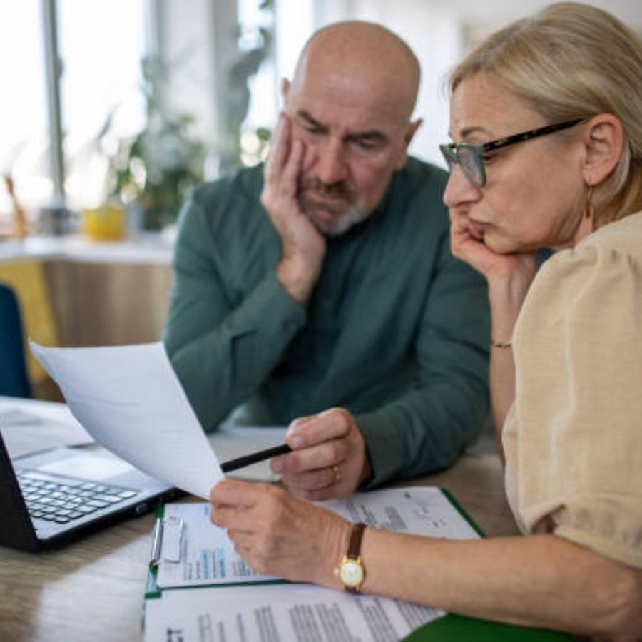 senior couple reviewing timeshare contract
