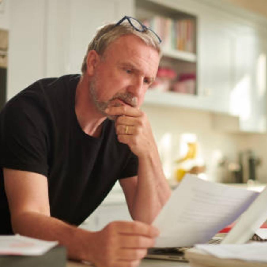 senior man reviewing a timeshare contract