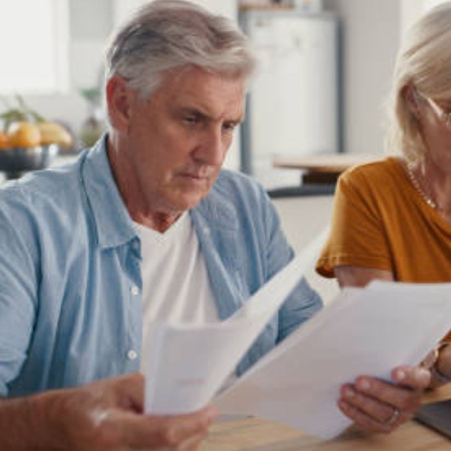 senior man reviewing timeshare documents
