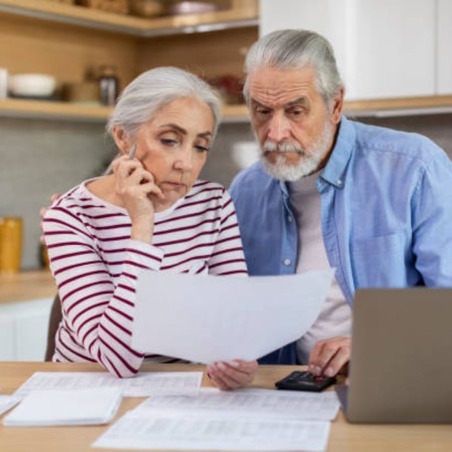 senior couple reviewing timeshare contract