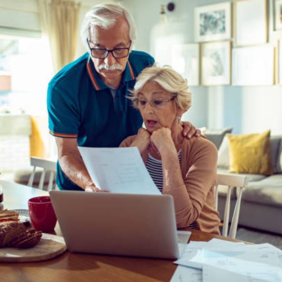 senior couple reviewing timeshare contract