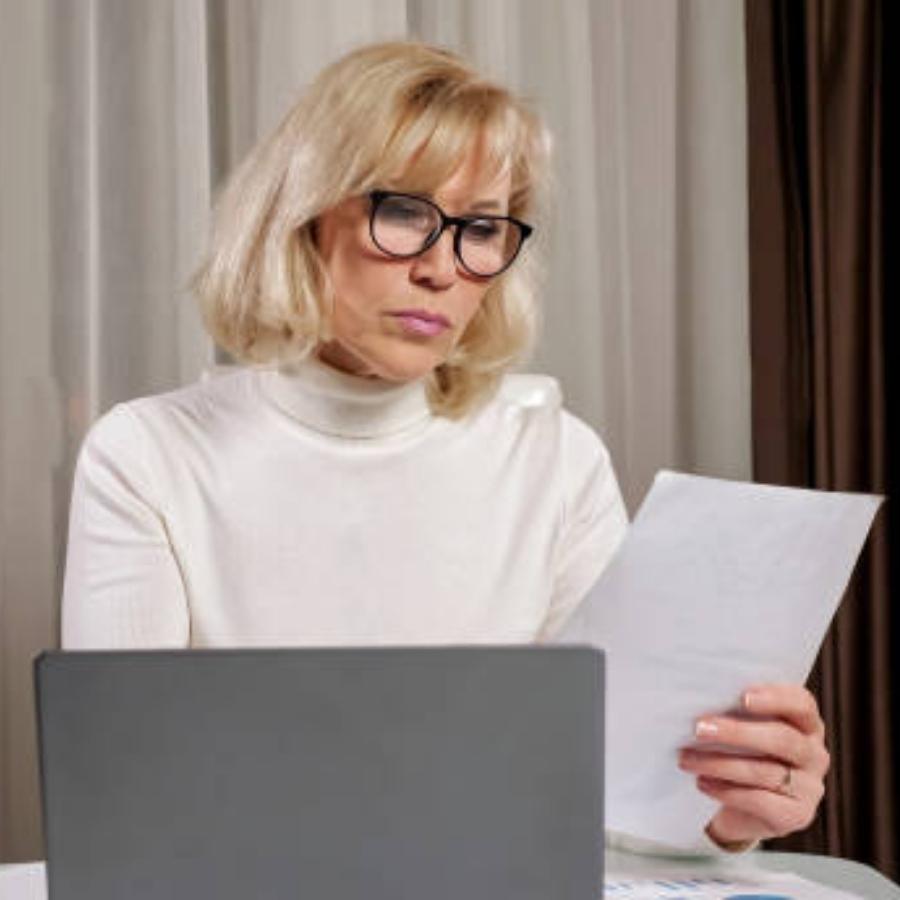 senior woman reviewing a timeshare contract