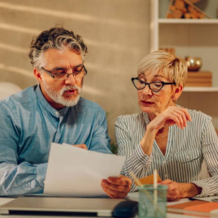 senior couple reviewing timeshare contract