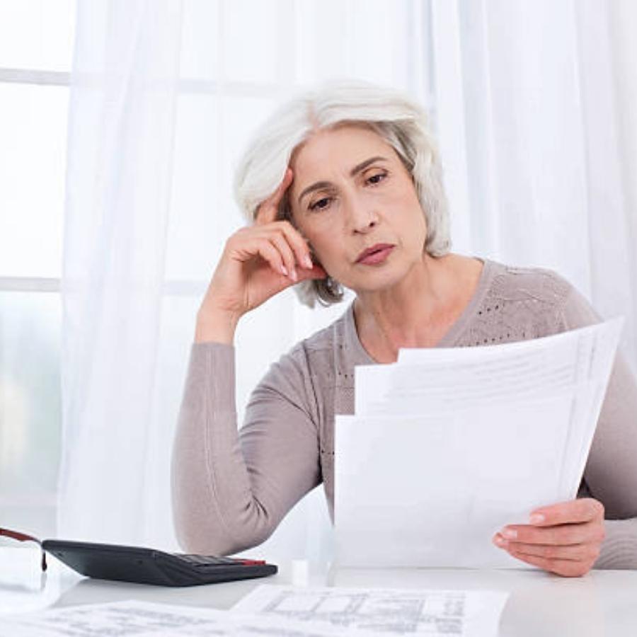 senior woman reviewing a timeshare contract