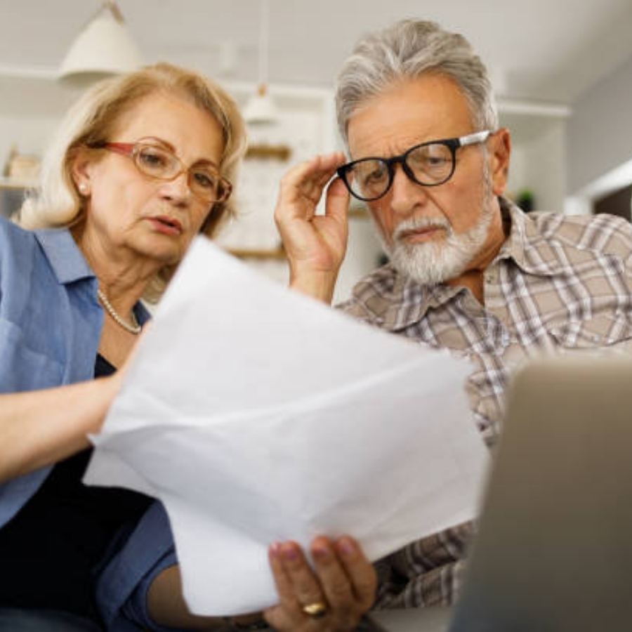 senior couple reviewing timeshare contract