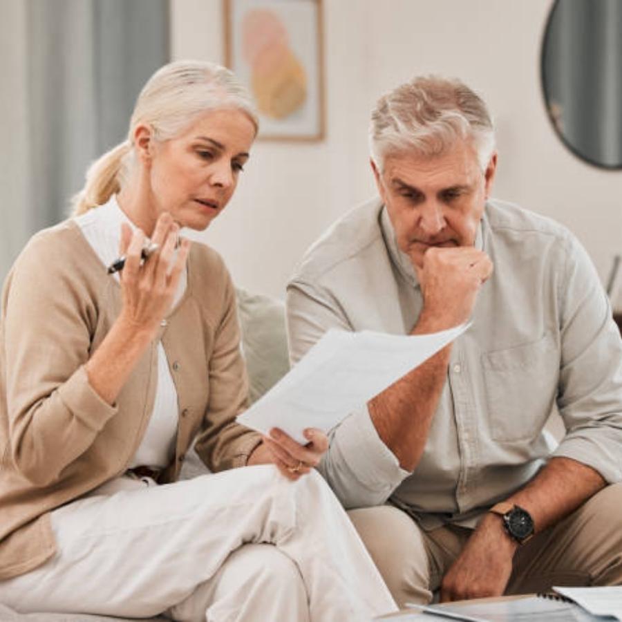 stressed senior couple reviewing a timeshare cancellation