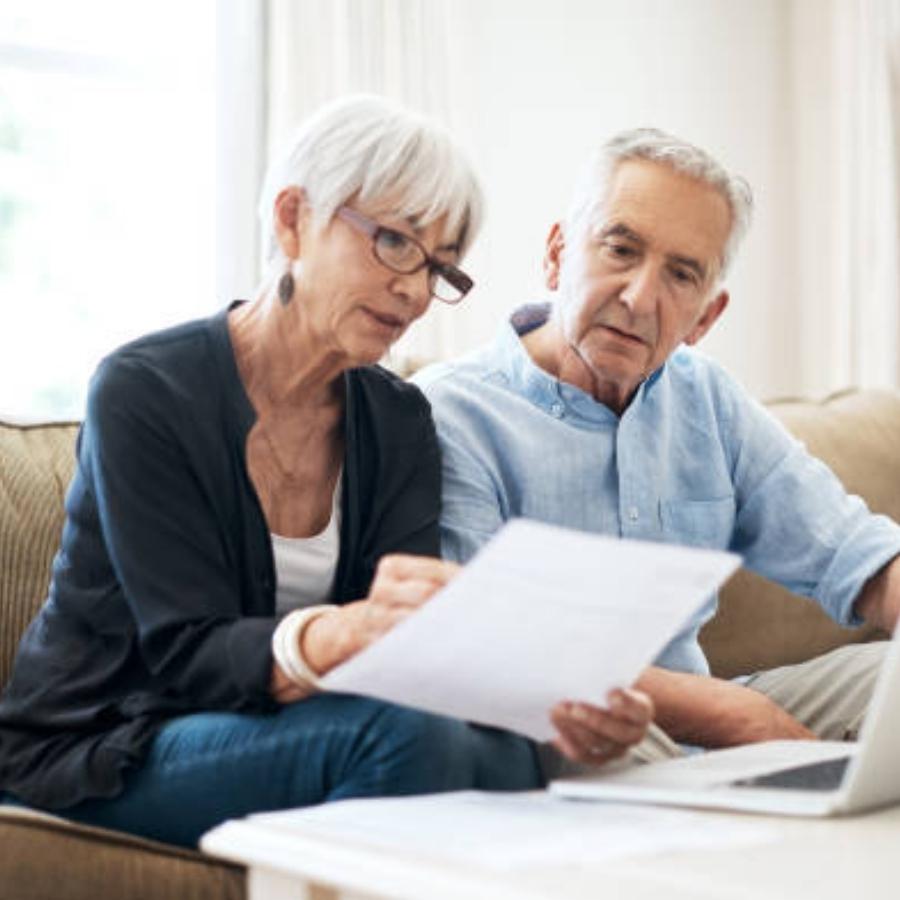 stressed senior couple reviewing a timeshare cancellation contract