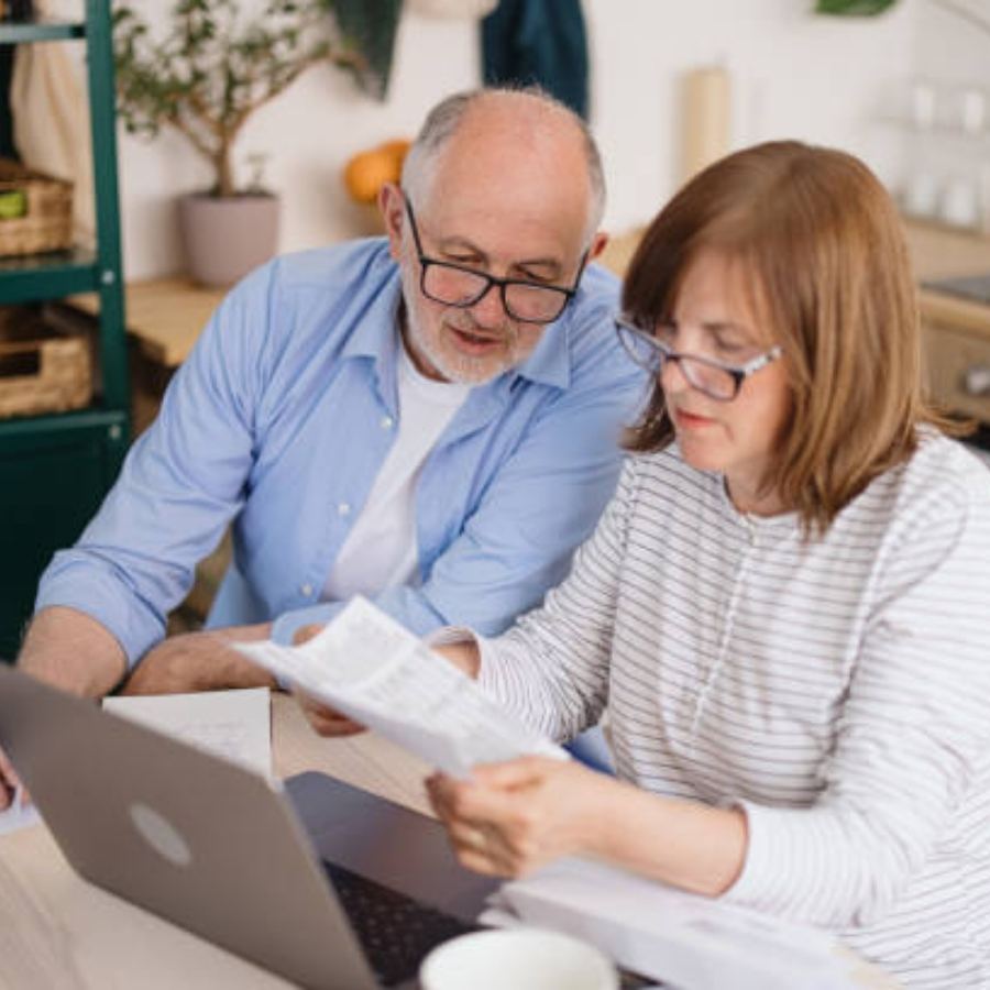 senior couple reviewing timeshare contract
