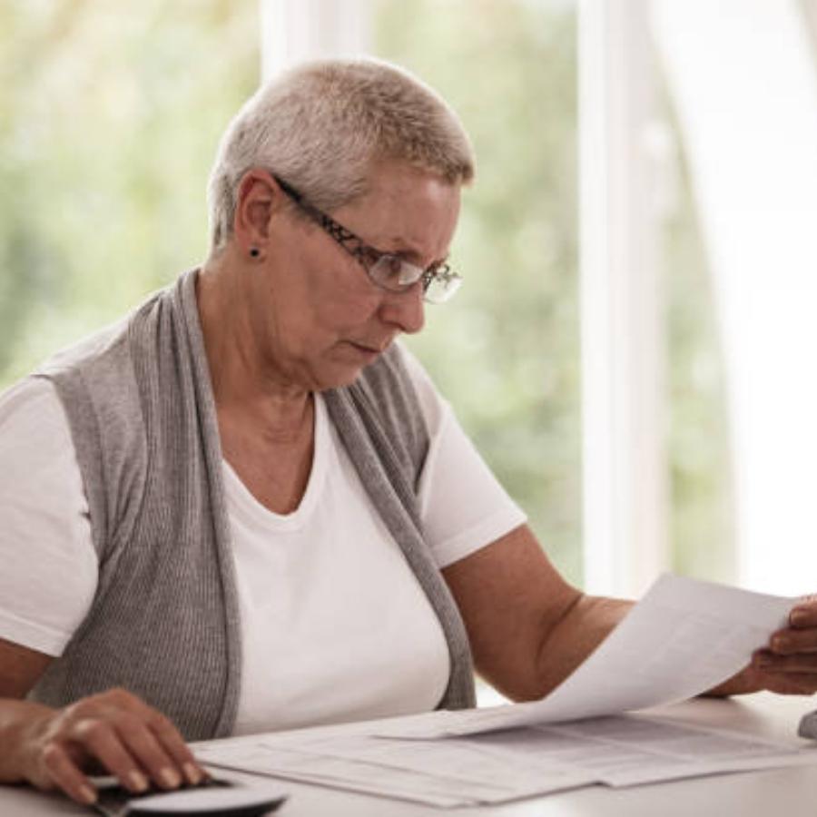 senior woman reviewing a timeshare contract