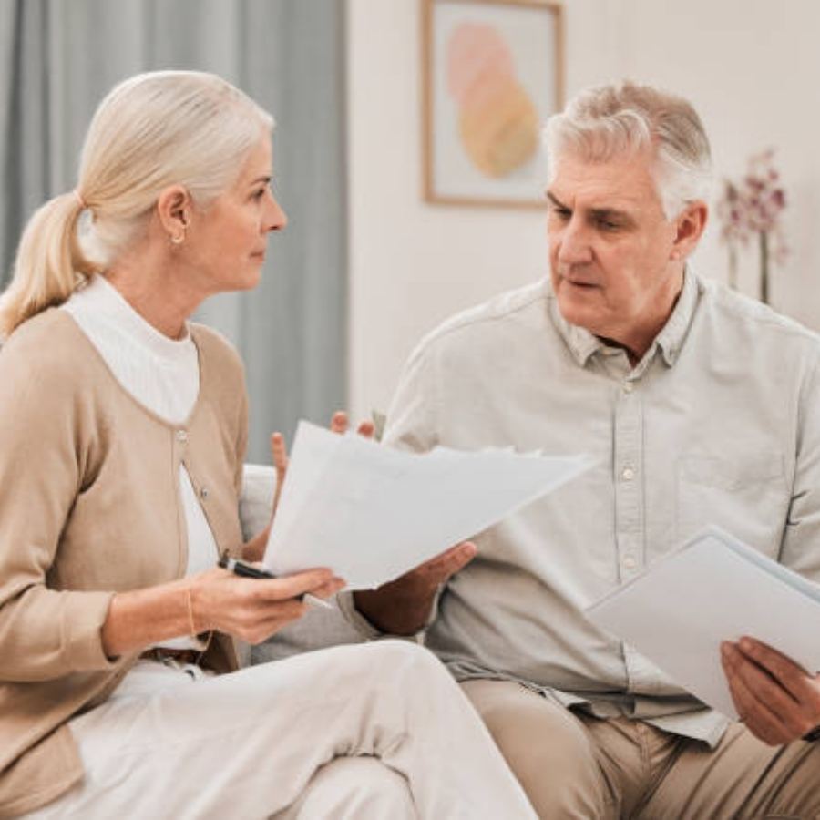 senior couple reviewing timeshare contract