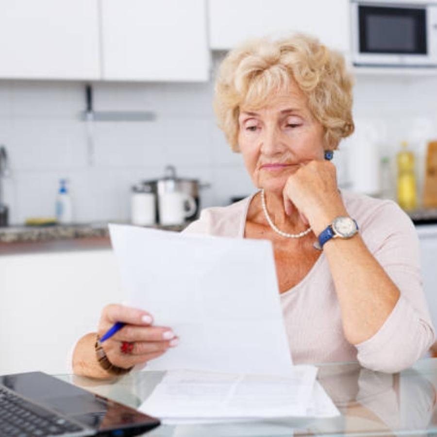 senior woman reviewing a timeshare contract
