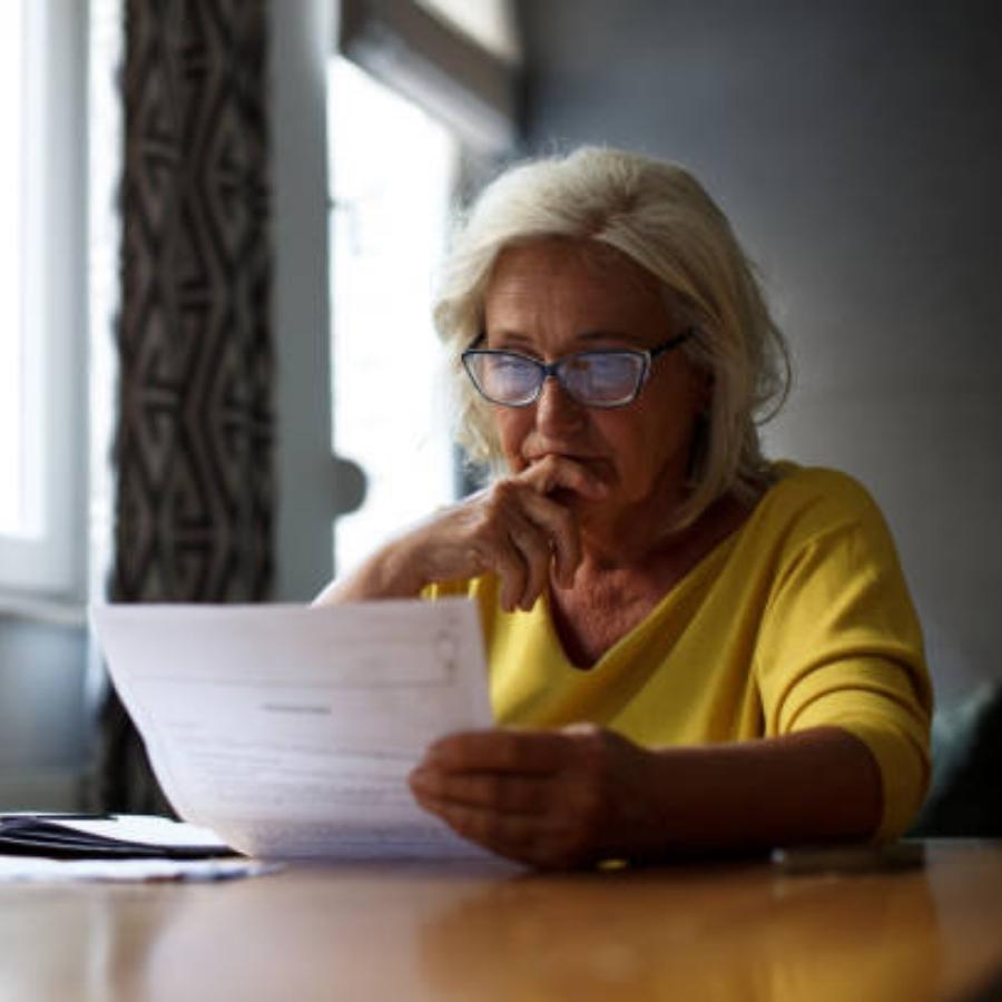 senior woman reviewing a timeshare contract