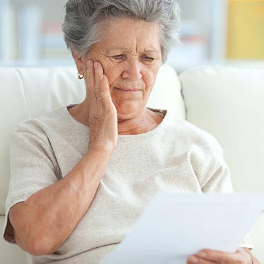 senior woman reviewing a timeshare contract