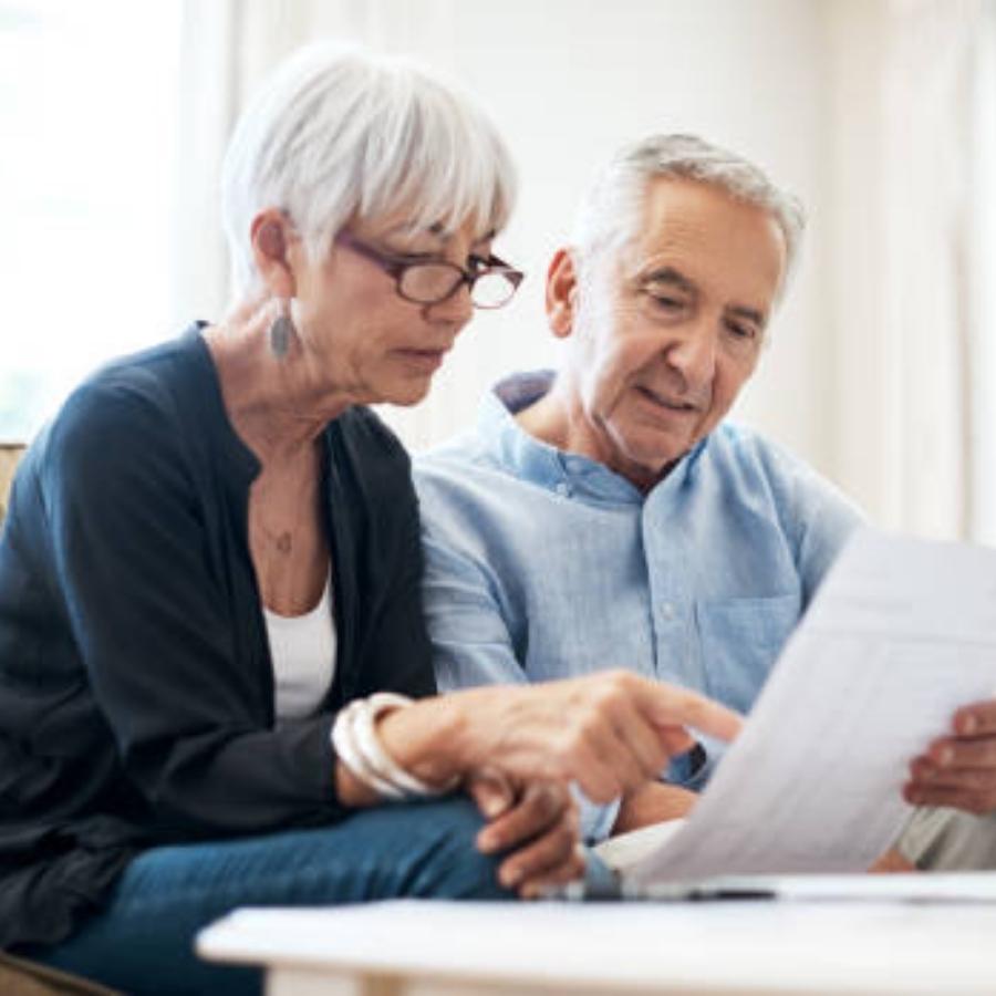 senior couple reviewing a timeshare cancellation contract