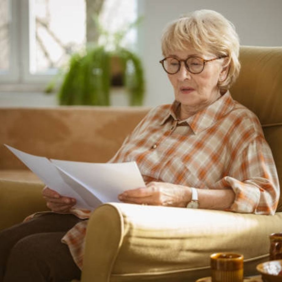 senior woman reviewing timeshare contract