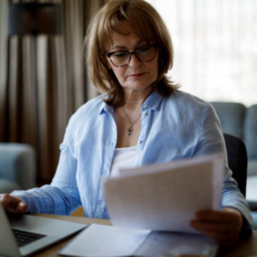 senior woman reviewing a timeshare contract