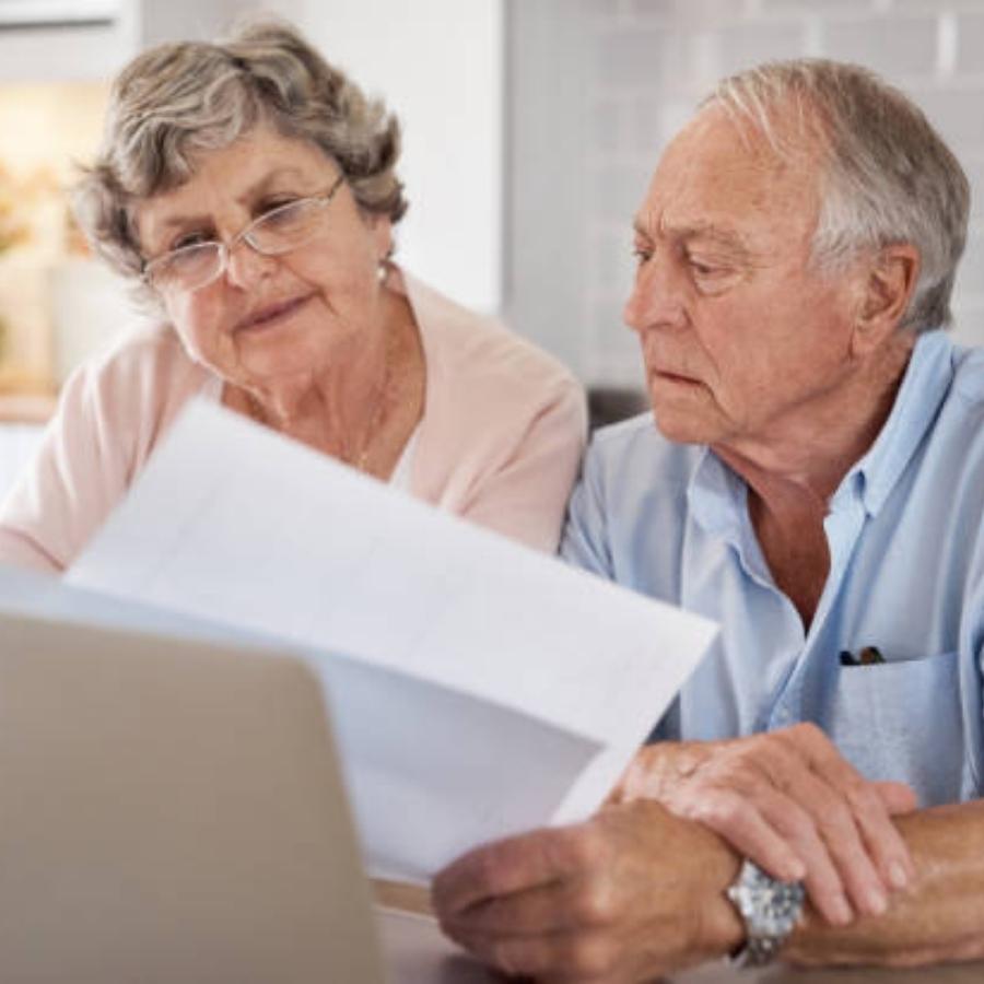 stressed senior couple reading timeshare cancellation contract