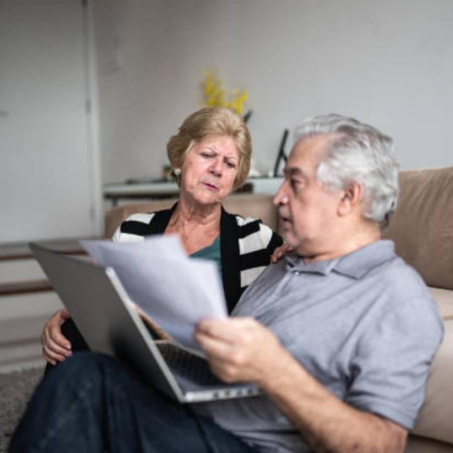 senior couple reviewing a timeshare cancellation contract