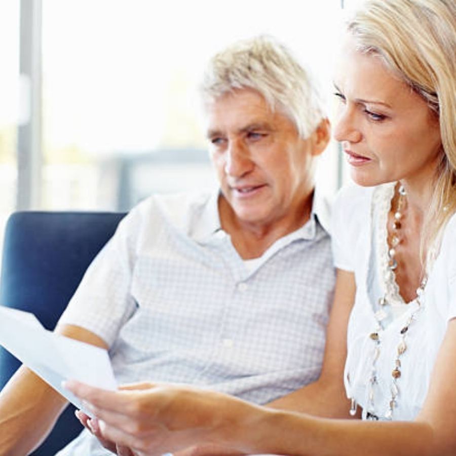 senior couple reviewing timeshare contract