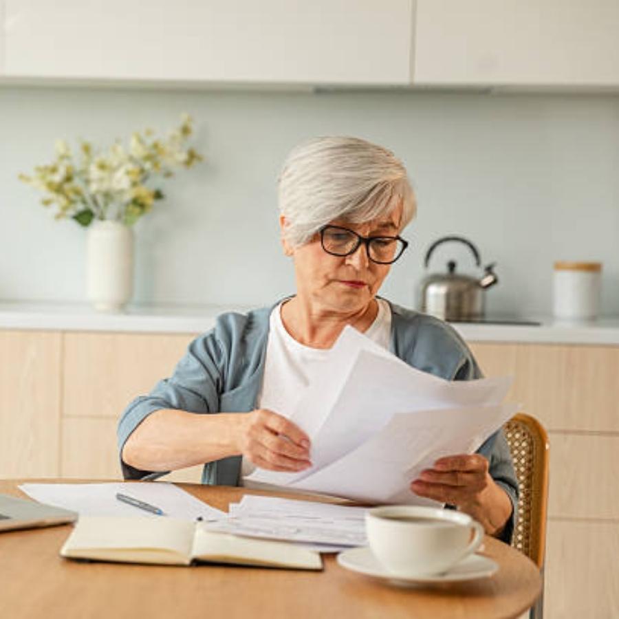 senior woman reviewing a timeshare contract