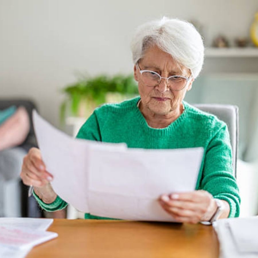 senior woman reviewing timeshare contract