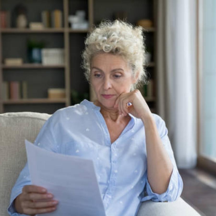 senior woman reviewing a timeshare contract