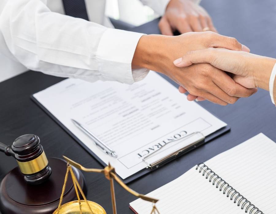 timeshare lawyer shaking hands with a client