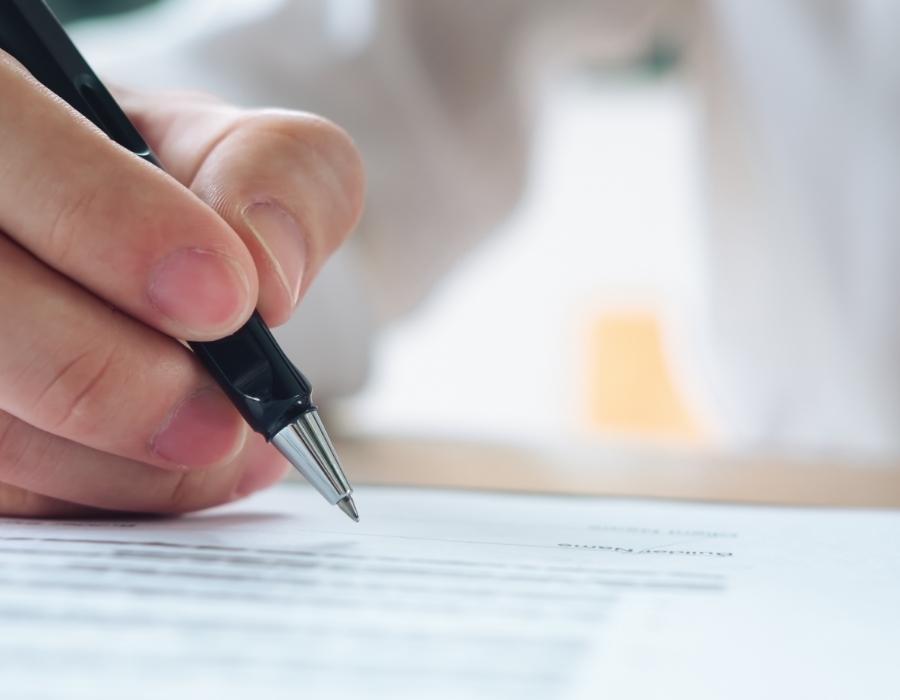 timeshare lawyer signing a timeshare cancellation contract